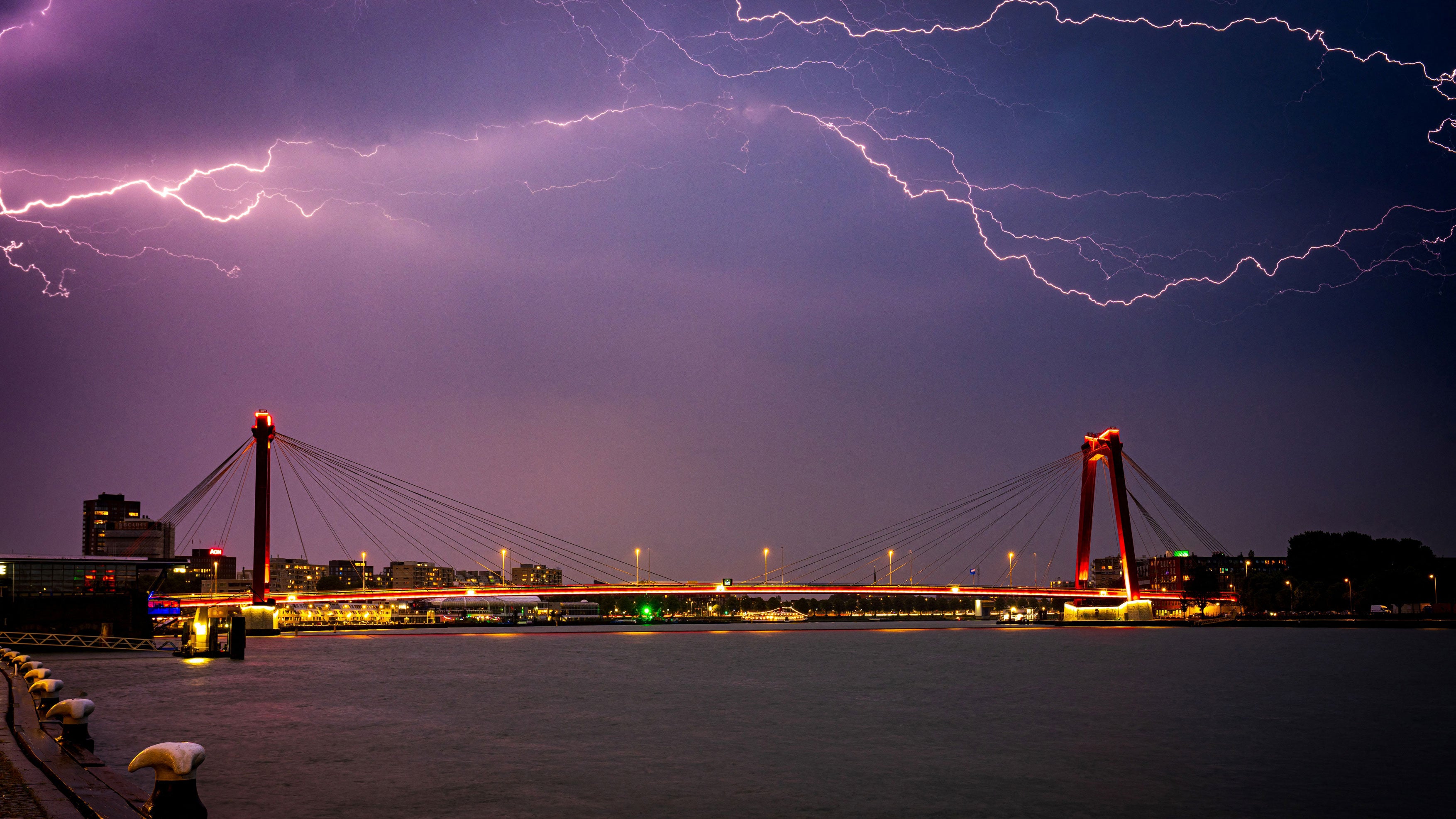 Lightning strikes illuminate the sky above Rotterdam on June 19, 2026.