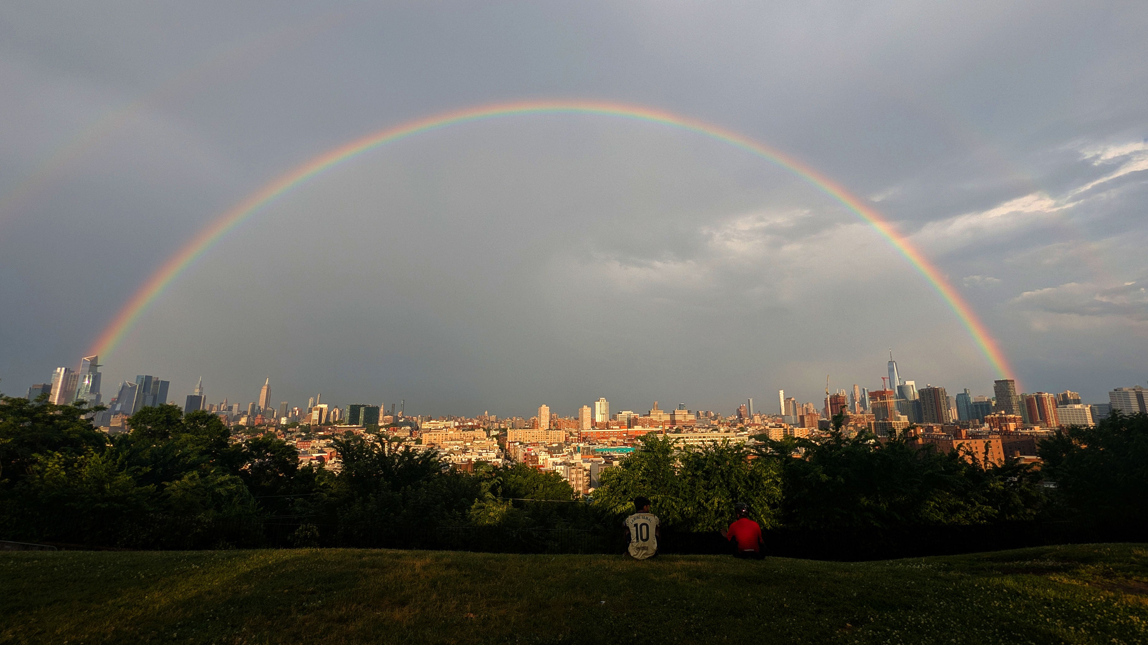 A rainbow forms between midtown Manhattan and lower Manhattan after a thunderstorm passed through New York City on June 12, 2026, as seen from Jersey City, New Jersey. 