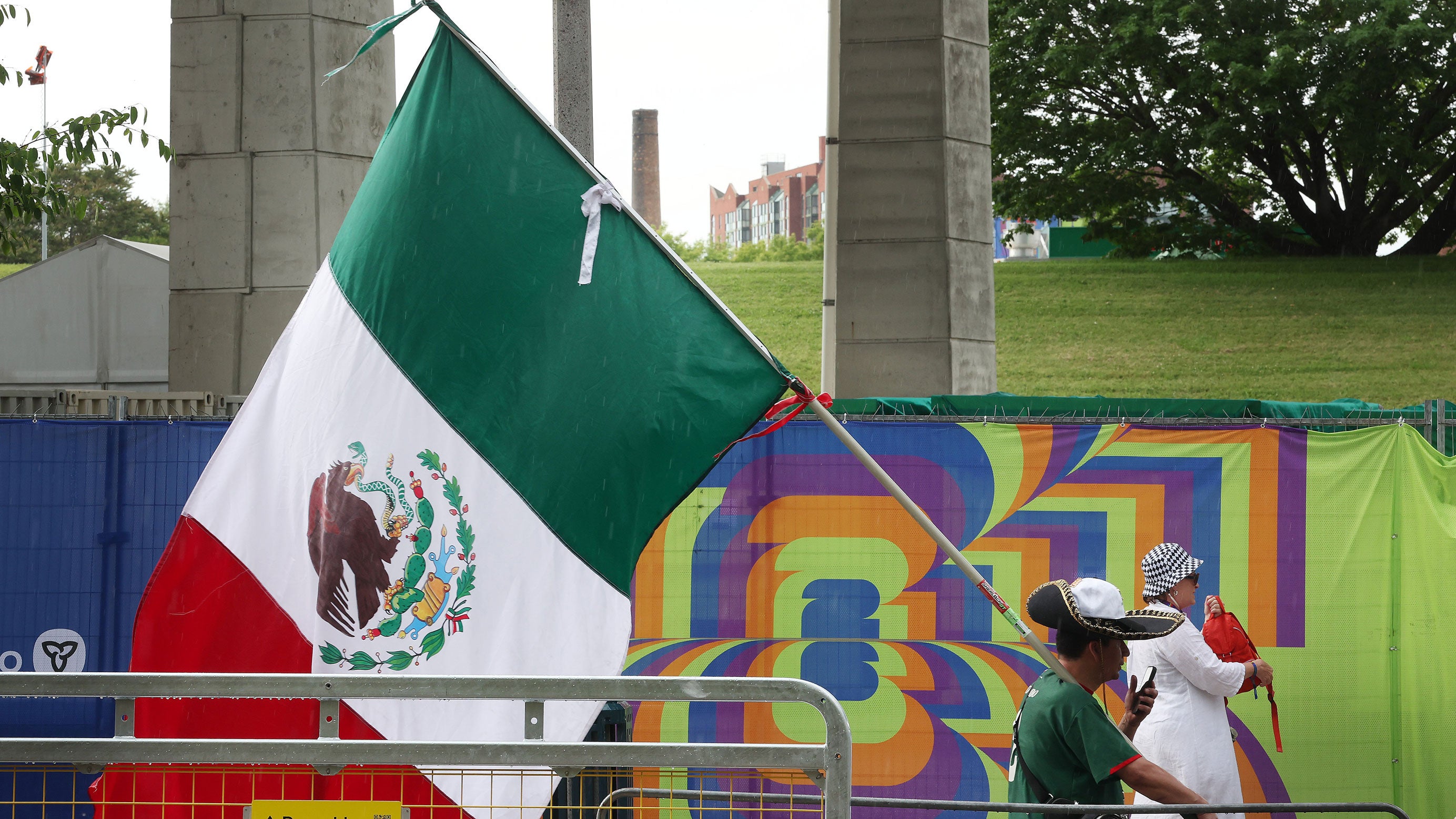 Fans leave the FIFA 2026 World Cup Fanfest watch party for Mexico versus South Africa after the event was evacuated because of a thunderstorm at Fort York in Toronto on June 11, 2026.