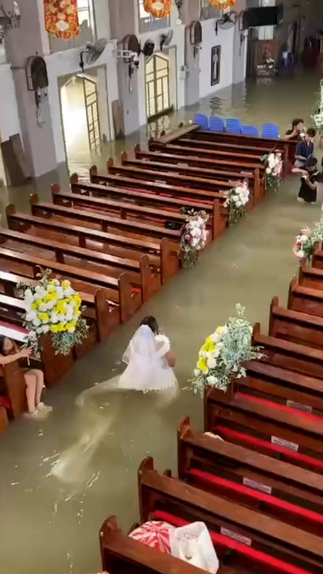 Couple weds in flooded church