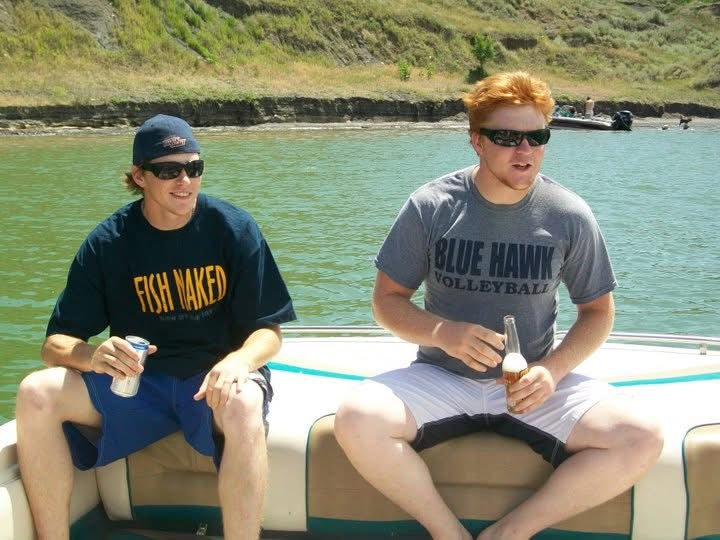Twin brothers Trampus Haskvitz (left) and John Haskvitz (right) on a boat together. Trampus Haskvitz was killed in killed in the Cole Canyon Fire on August 11, 2011.