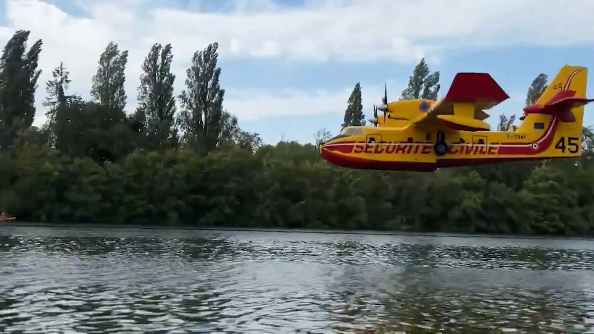 Planes scoop the Seine to battle a wildfire near Paris